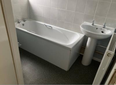 Bathroom bath with overhead shower