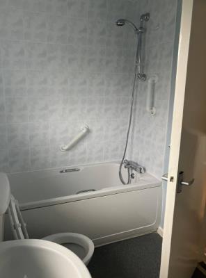 Bath with overhead shower