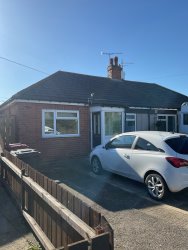Front view of property with drive way